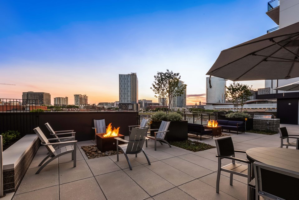 Luxury amenities include social spaces featuring firepits, outdoor grills and a game area next to a saltwater pool. (Photo credit: Kaltenbach Photography)