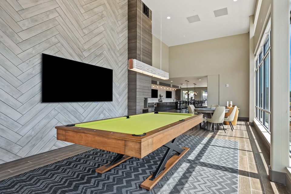 A highlight of Sixth South is the resident clubroom lounge that features a pool table and large screen TV. (Photo credit: Kaltenbach Photography)
