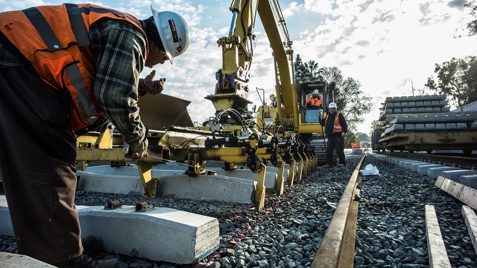workers-lay-railroad-ties-at-expo-line